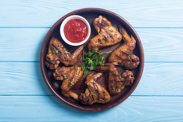 Grilled chicken wings with tomato sauce
