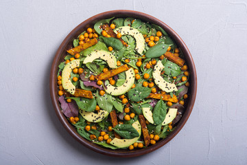 Baby spinach salad with sweet potato , chickpeas and avocado