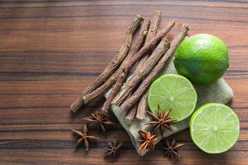 licorice root, lemon and anise on the table.