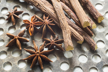 licorice root and anise on the table - Glycyrrhiza glabra