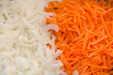 Background onions carrots. The texture of onions and carrots. Sliced onions and carrots.