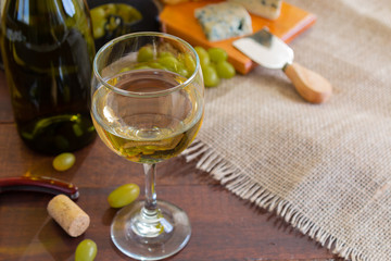 wine table with cheese and grapes