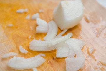 Sliced onions. Background bow. Fresh onions on the table.