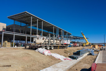 Aerial view of construction site with building structure and no walls