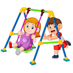 the children have fun playing swings 
