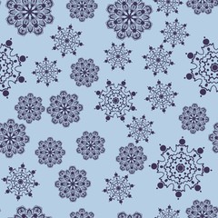 Dark blue snowflakes falling down on azure background