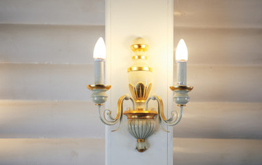 Old vintage wall lamp. Vintage style lamp with candlesticks