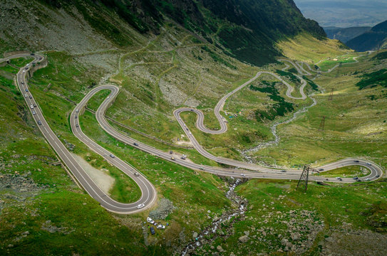 Aerial view of Balea lake and curving road of the Transfagaras pass in Romania