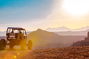 A Custom 4x4 Rock Crawler Off-Roading In The Sandstone Red Rock Terrain Outside Of Moab Utah In The...