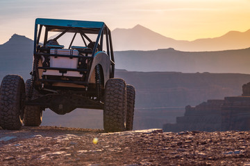 A Custom 4x4 Rock Crawler Off-Roading In The Sandstone Red Rock Terrain Outside Of Moab Utah In The...