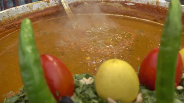 G07_Street food, Dal Bhat cooking in a big pot in Jaipur,. Dal bhat is a traditional meal from the Indian subcontinent.