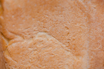 The texture of the crust of bread. Hot fresh bread. Bread close up.