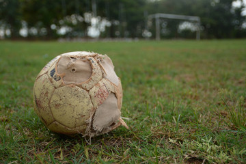 old ball on football field
