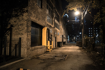 Dark and eerie urban city alley at night - obrazy, fototapety, plakaty