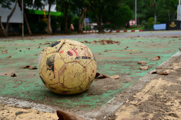 old ball on concrete field