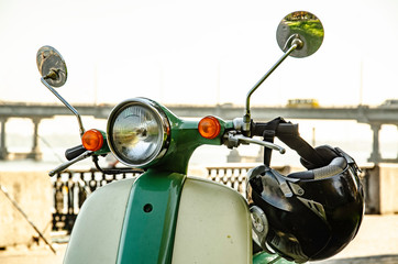 Fototapeta premium Scooter on the city waterfront.