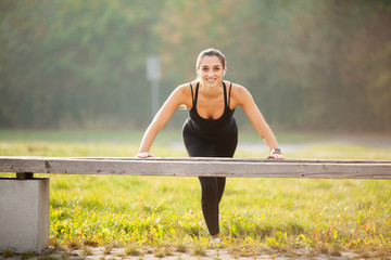 Side view of a motivated asian. Portrait of beautiful sporty woman 20s in sportswear doing...