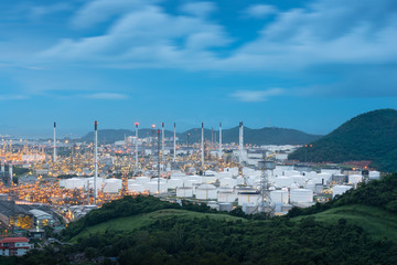 Industrial oil tanks in a Petrochemical plant at twilight