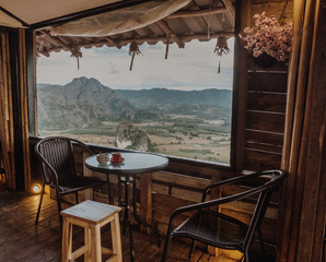 Rural Home in the North of Thailand with Beautiful Mountain View of Phu Langka National Park, Thailand. This home made from wood with table and chair to enjoy the view