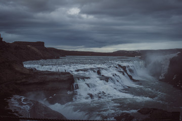 storm clouds over the river. Iceland falls