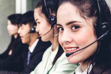Beautiful businesswoman customer support services working with headset and computer at call center