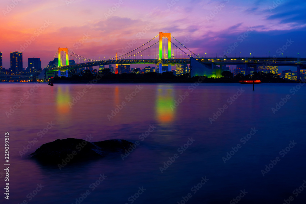 Poster colorful illuminations at rainbow bridge from odaiba in tokyo, japan