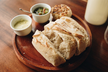 Appetizer food ; Bread and butter serve on wooden plate