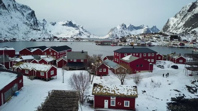 4k Drone footage - Racks of dried cod fish in Reine, Norway.  Lofoten Islands