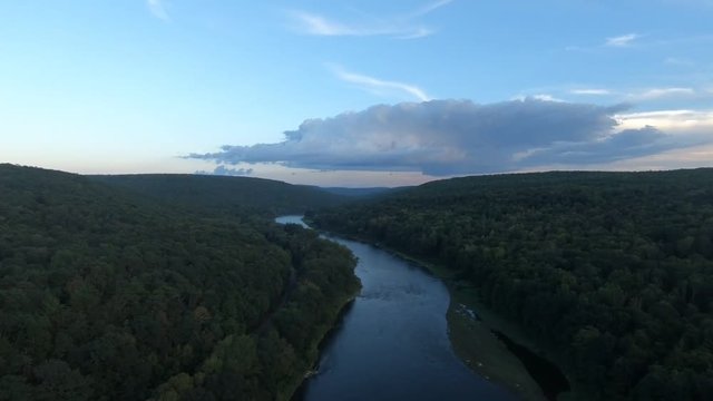 Beautiful aerial shot of river carving through mountains.