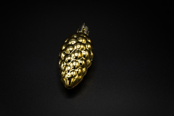 Golden pine cone for Christmas tree.