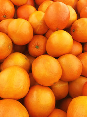 Healthy fruits, orange fruits background many orange fruits - orange fruit background in a supermarket super store