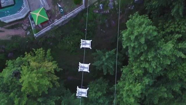 Aerial view of cable car ride, sky chair lift for tourist at hill station resort
