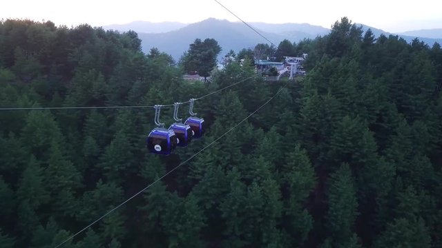 Aerial view of cable car ride, sky chair lift for tourist at hill station resort