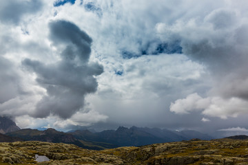 Beautiful summer scenery in the Dolomite Alps, Italy, with dramatic storm clouds