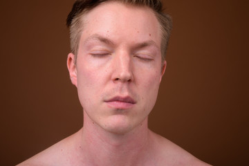 Obraz premium Portrait of young man face relaxing with eyes closed