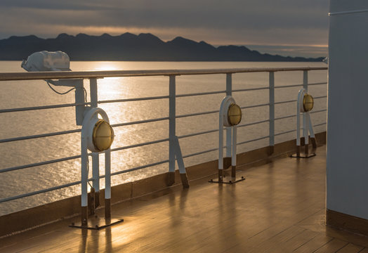 Nautical cruise ship deck lighting metal and brass exterior fixtures.