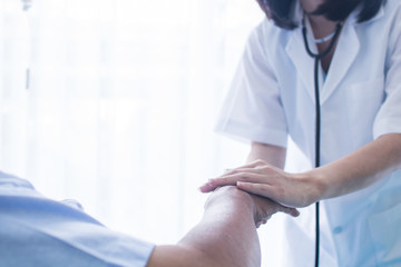 Consolation and encouragement concept doctor holding hands of patient and resolve problem and take care