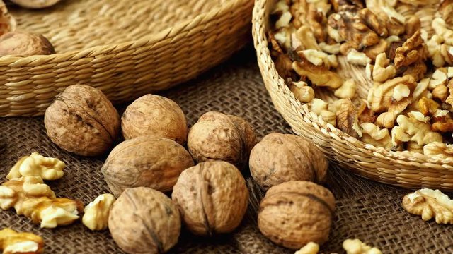 Walnuts on rustic natural burlap, Walnut kernels in wicker basket, Walnut background
