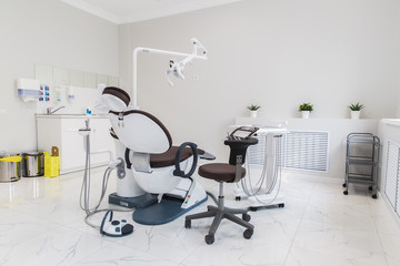 medicine, stomatology, dental clinic office, medical equipment and instruments for dentistry - dentistry equipment, brown chair