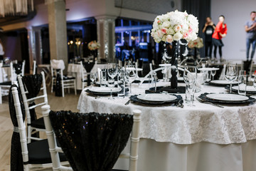 Beautifully decorated tables for guests. Wedding preparation catering service