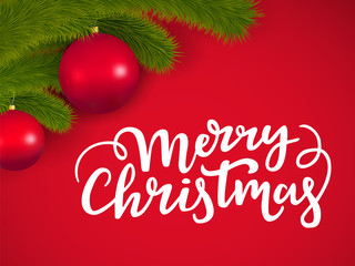 Merry Christmas lettering on a red background with decorative New Year tree branches with a glass balls.