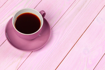 Bright colored coffee cup on a table top view