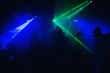 Fototapeta na wymiar people dancing in a nightclub on the dance floor at a party