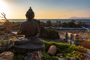 Sunset Over Representation Of Sitting Protection Buddha