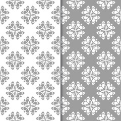 Fototapeta premium White and gray floral backgrounds. Set of seamless patterns