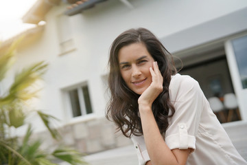 Portrait of attractive brunette woman, outdoor scene