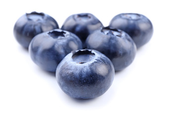 Ripe blueberries on white background