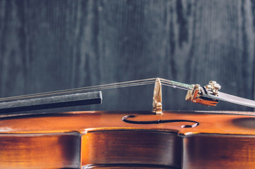 The violin on the dark table, Classic musical instrument used in the orchestra.