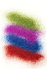 Four bright stripes of early glitter isolated on white background.