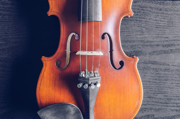 The violin on the dark table, Classic musical instrument used in the orchestra.